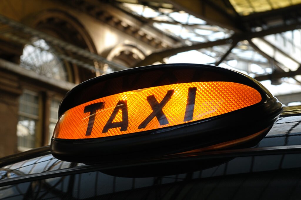 Taxi Preparation lessons - an iconic image for this service showing a TAXI sign on top of a black cab.